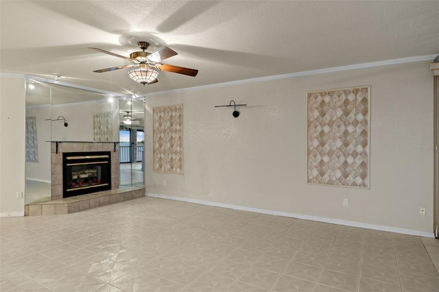 unfurnished living room with ceiling fan, a fireplace, crown molding, and a textured ceiling