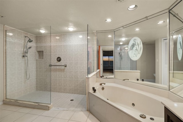 bathroom with independent shower and bath, tile patterned floors, and vanity