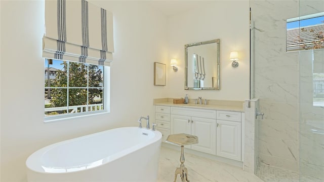 bathroom featuring vanity, plus walk in shower, and a wealth of natural light