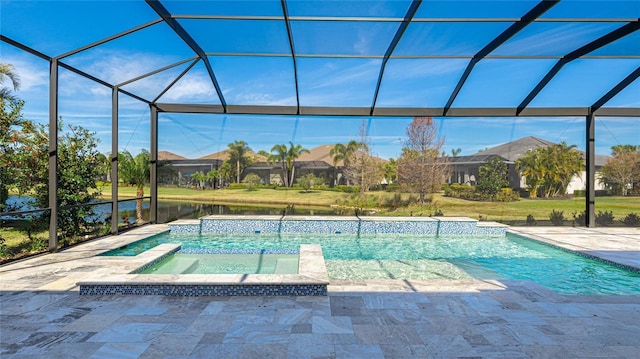 view of pool featuring an in ground hot tub, a water view, a patio area, and glass enclosure