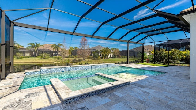 view of pool featuring a patio area, glass enclosure, and an in ground hot tub