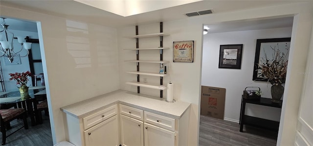 interior space featuring white cabinets and dark wood-type flooring