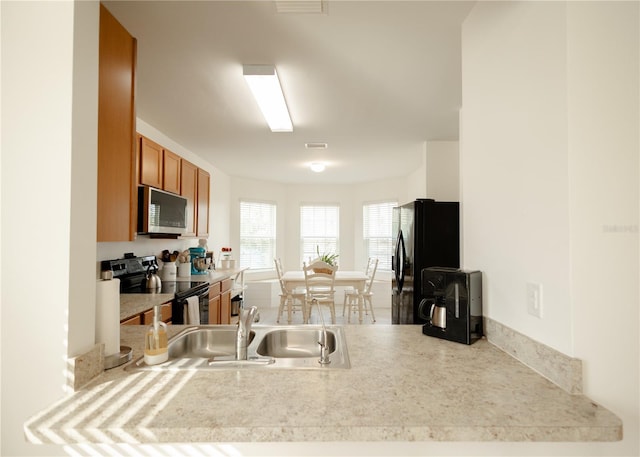 kitchen featuring appliances with stainless steel finishes and sink