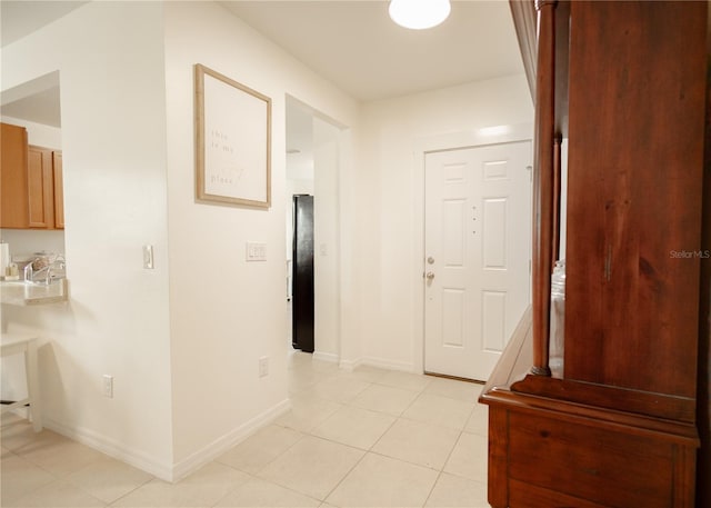 corridor featuring light tile patterned flooring