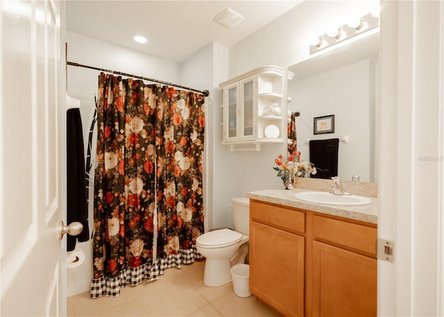 bathroom with tile patterned floors, vanity, and toilet