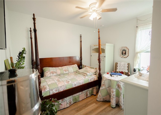 bedroom featuring hardwood / wood-style floors and ceiling fan