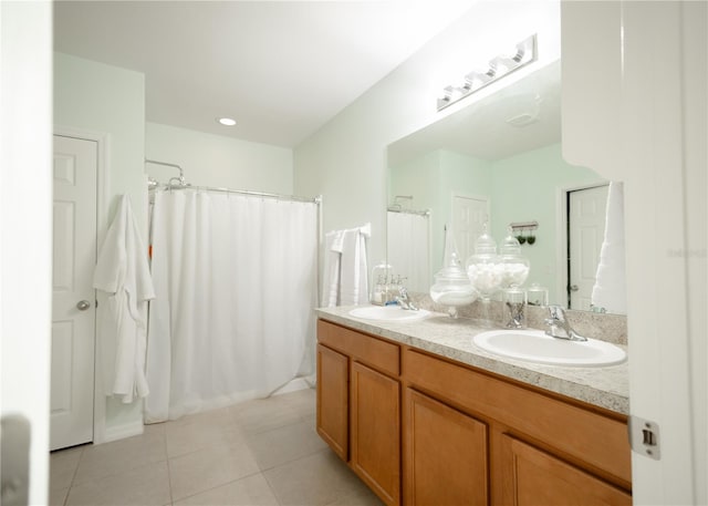 bathroom with a shower with curtain, tile patterned flooring, and vanity