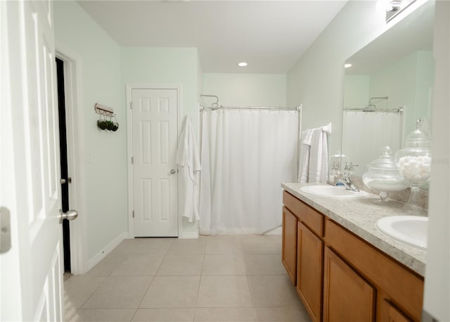 bathroom featuring tile patterned flooring, a shower with curtain, and vanity