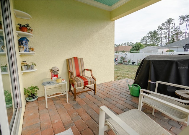 view of patio featuring a grill