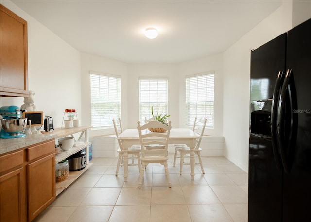 dining space with light tile patterned floors