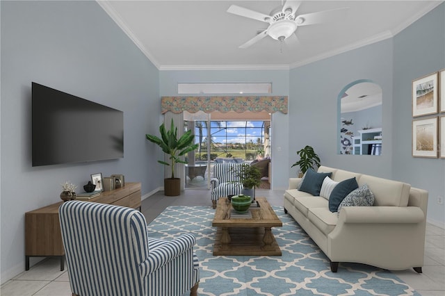 living area featuring ceiling fan, ornamental molding, tile patterned flooring, and baseboards