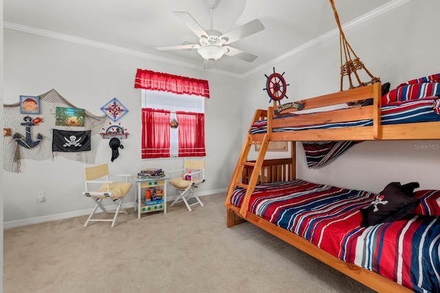 bedroom featuring baseboards, carpet floors, ceiling fan, and crown molding