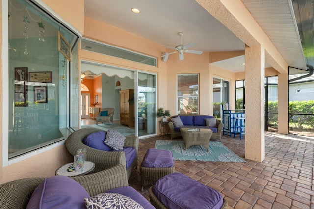 view of patio with a ceiling fan and an outdoor living space