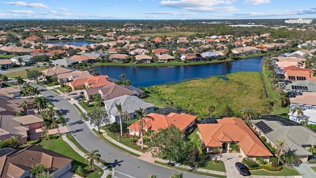 aerial view featuring a residential view and a water view