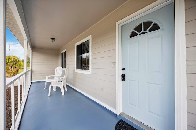 property entrance featuring covered porch