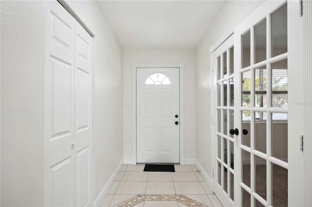 entryway featuring light tile patterned flooring