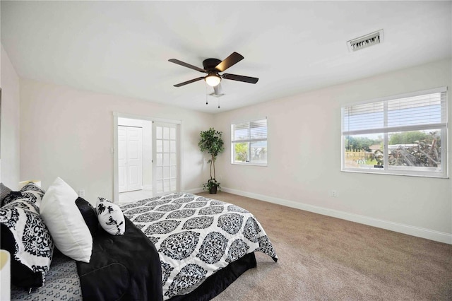 carpeted bedroom featuring ceiling fan