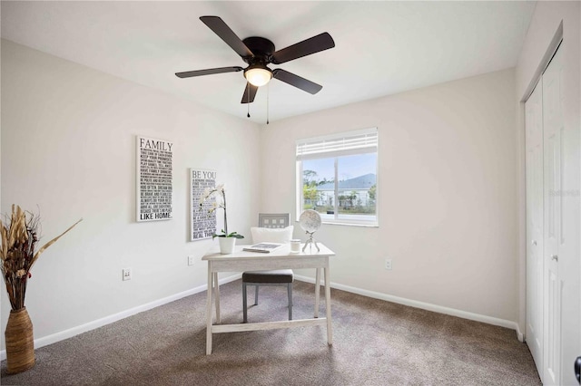 office space with carpet and ceiling fan