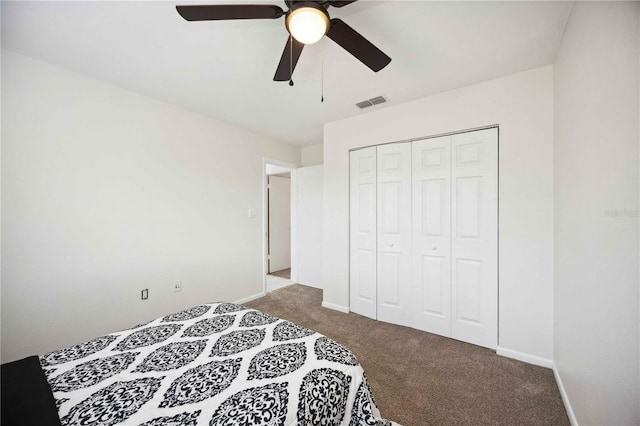 bedroom featuring light carpet, a closet, and ceiling fan