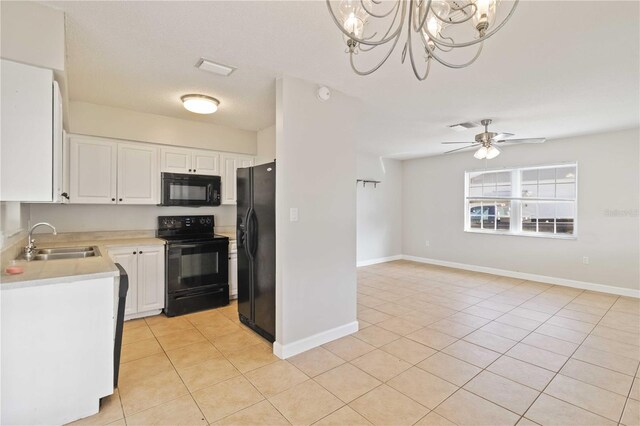 kitchen with black appliances, white cabinets, ceiling fan with notable chandelier, sink, and decorative light fixtures