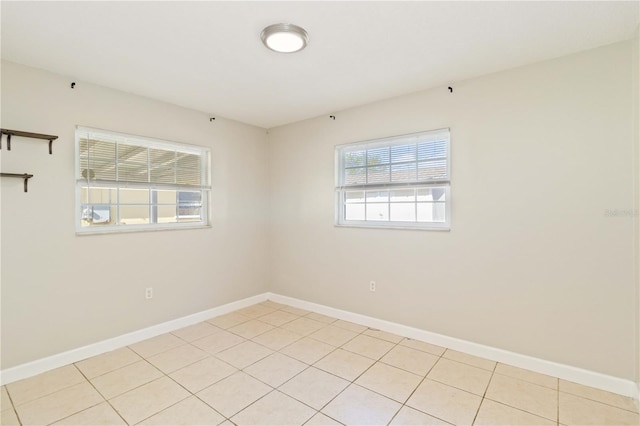 empty room featuring light tile patterned flooring