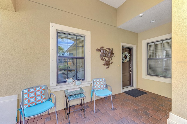 property entrance with a patio area