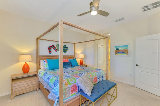 carpeted bedroom featuring a closet and ceiling fan