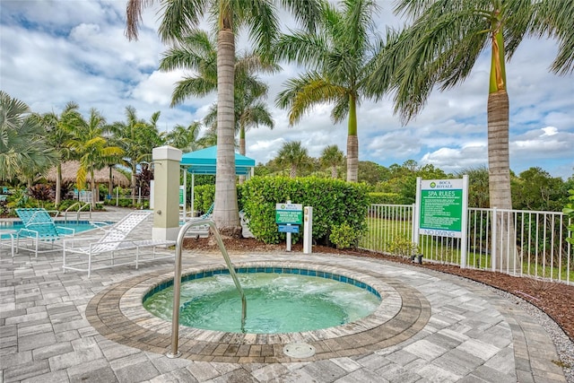 view of pool featuring a hot tub