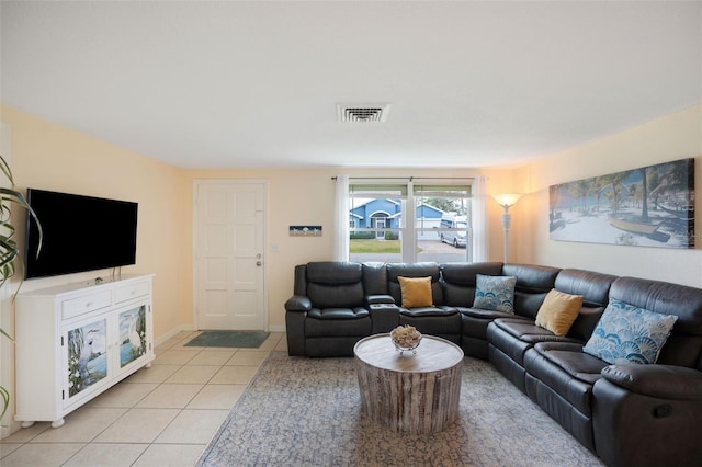 living room with light tile patterned flooring