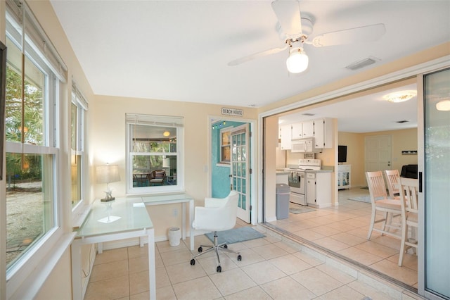 home office featuring ceiling fan and light tile patterned flooring