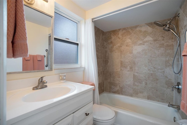 full bathroom with shower / tub combo, vanity, and toilet