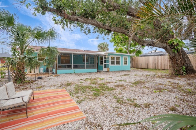 rear view of house with a sunroom