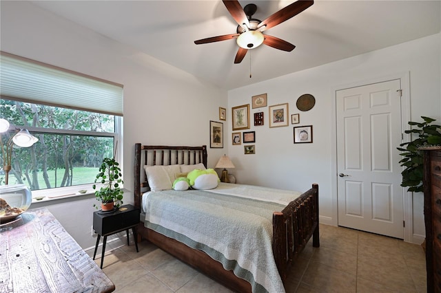 bedroom featuring ceiling fan and light tile patterned floors