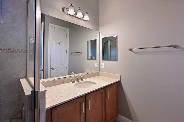 bathroom with vanity and an enclosed shower