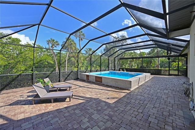 view of patio with glass enclosure