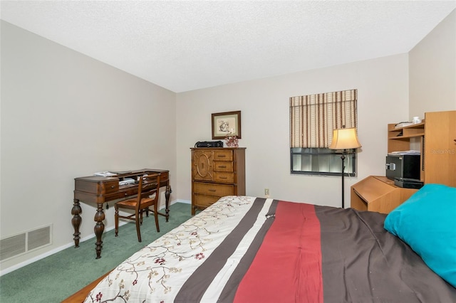 bedroom featuring dark colored carpet and a textured ceiling