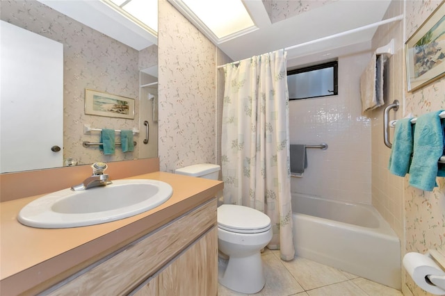 full bathroom featuring toilet, vanity, tile patterned floors, and shower / bath combo with shower curtain