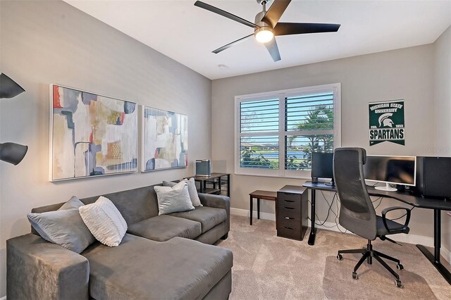 office area with light carpet and ceiling fan