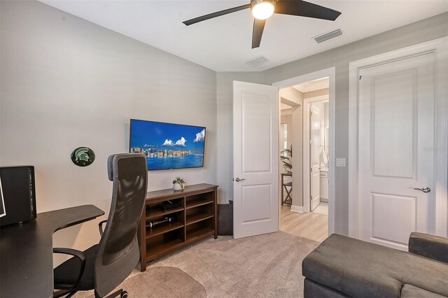 office with ceiling fan and light colored carpet