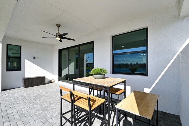 view of patio featuring ceiling fan