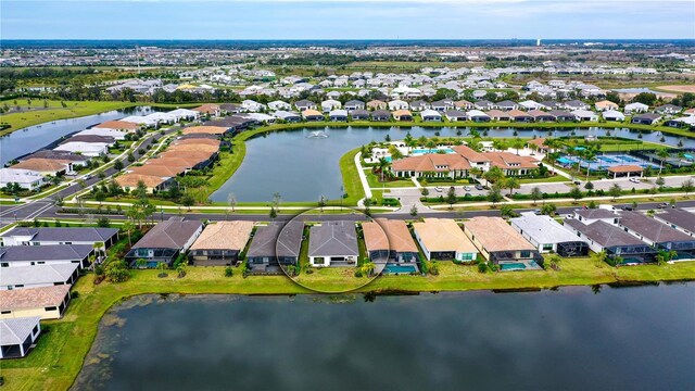 birds eye view of property featuring a water view