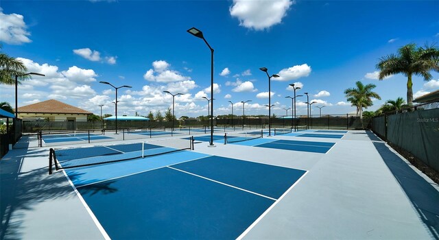 view of sport court featuring basketball hoop