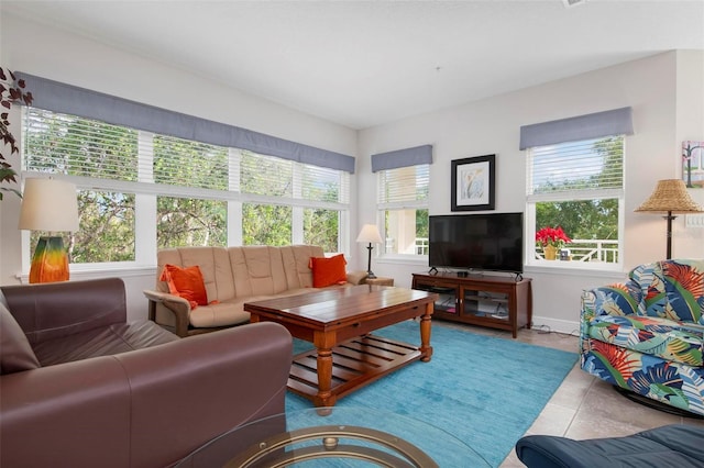 tiled living room with plenty of natural light