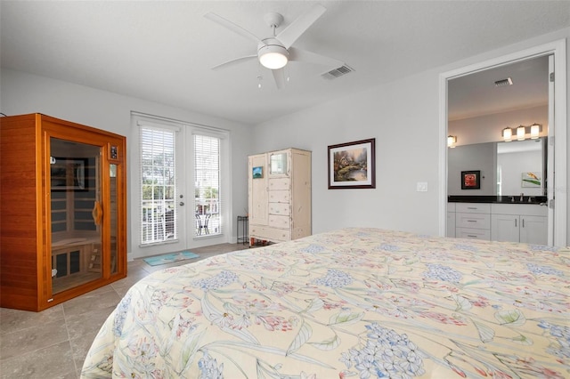 bedroom with french doors, ensuite bathroom, access to outside, ceiling fan, and sink