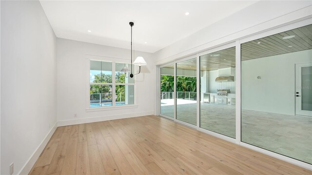 unfurnished dining area with light hardwood / wood-style floors