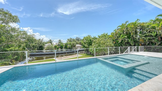 view of pool with an in ground hot tub