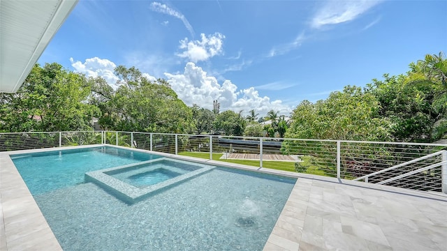 view of pool with an in ground hot tub