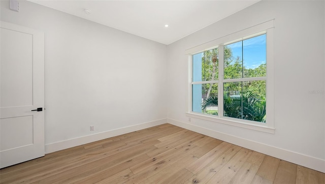 unfurnished room with light hardwood / wood-style floors