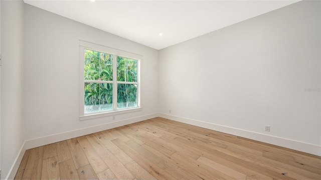 unfurnished room with light wood-type flooring