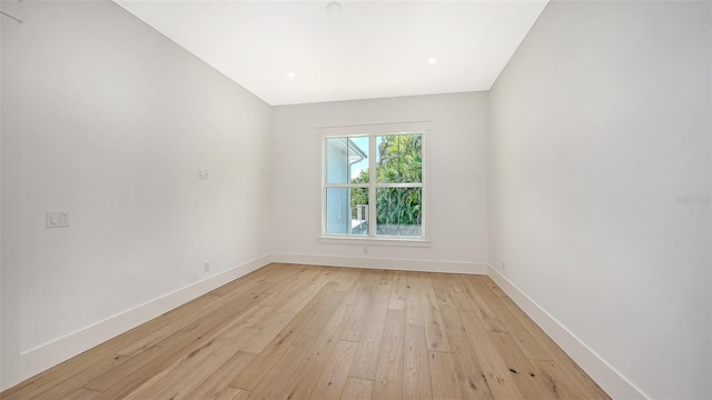 spare room with light hardwood / wood-style floors